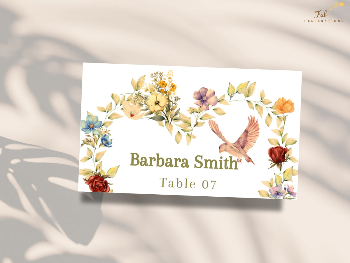 Botanical wedding place card displayed in soft natural light, featuring Barbara Smith and Table 07, watercolor-inspired floral accents, muted greenery, and a delicate dove illustration.