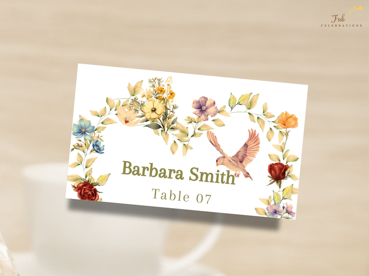 Classic romantic wedding name card with elegant guest lettering and Table 07, surrounded by delicate watercolor-inspired warm golden flowers, blush petals, sage greenery, and a dove.