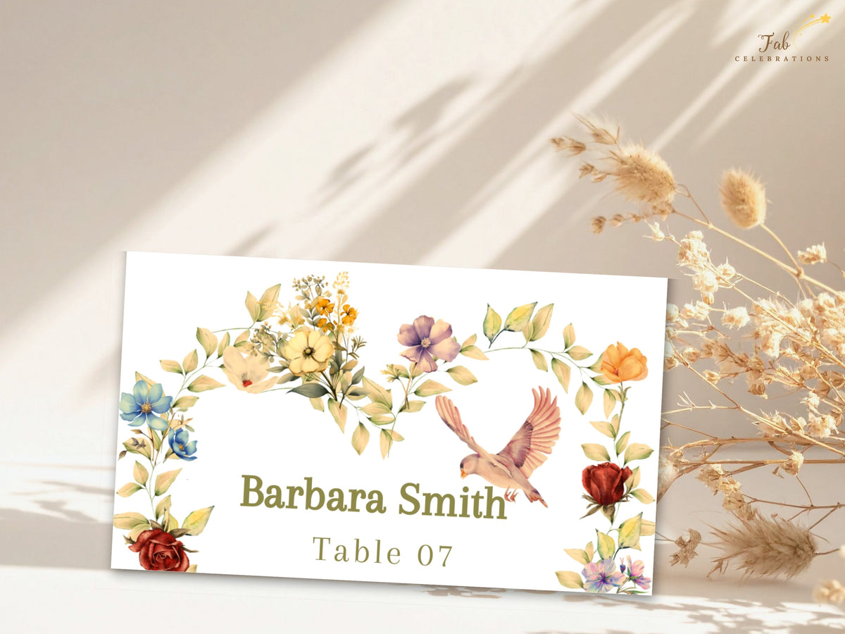 Elegant romantic wedding name card with Barbara Smith and Table 07 in refined lettering, complemented by watercolor-inspired floral details, sage leaves, and a delicate dove illustration.