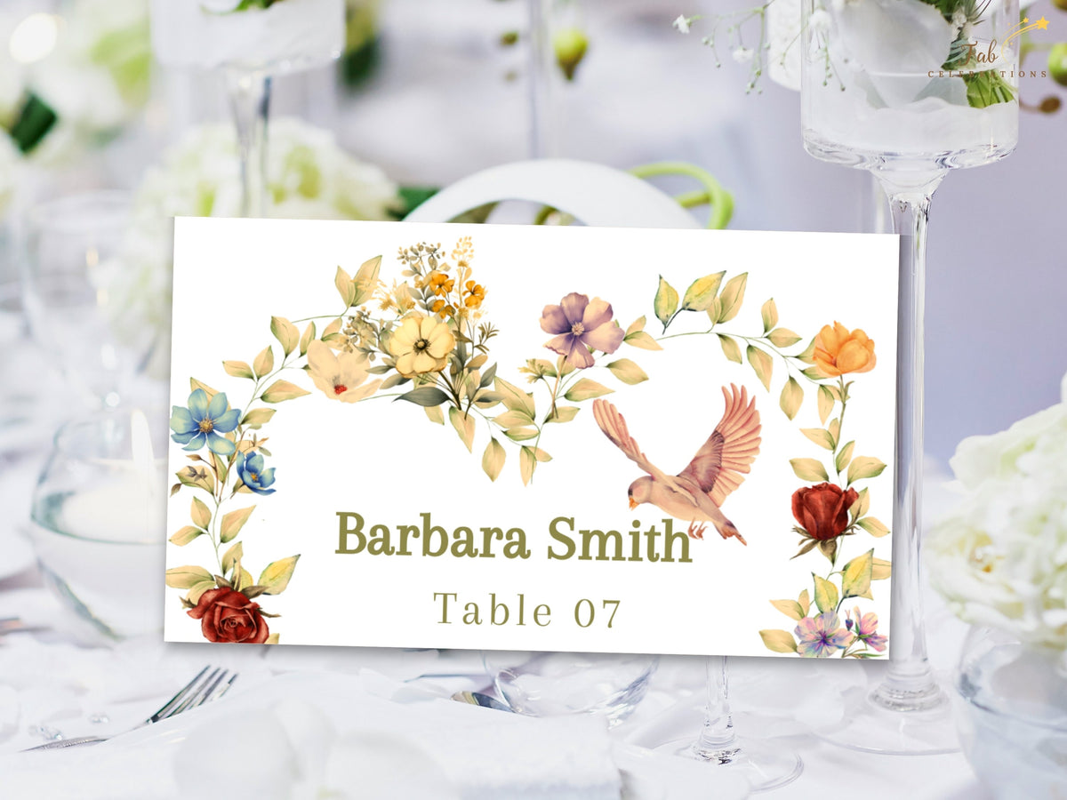 Floral wedding place card for a romantic reception table, showing Barbara Smith and Table 07 within watercolor-inspired flowers, soft sage leaves, and a graceful dove illustration.