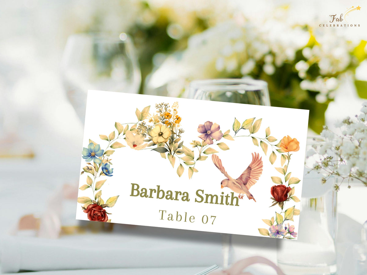 Garden reception place card featuring Barbara Smith and Table 07, decorated with delicate watercolor-inspired botanical flowers and a dove, displayed in an airy wedding table setting.