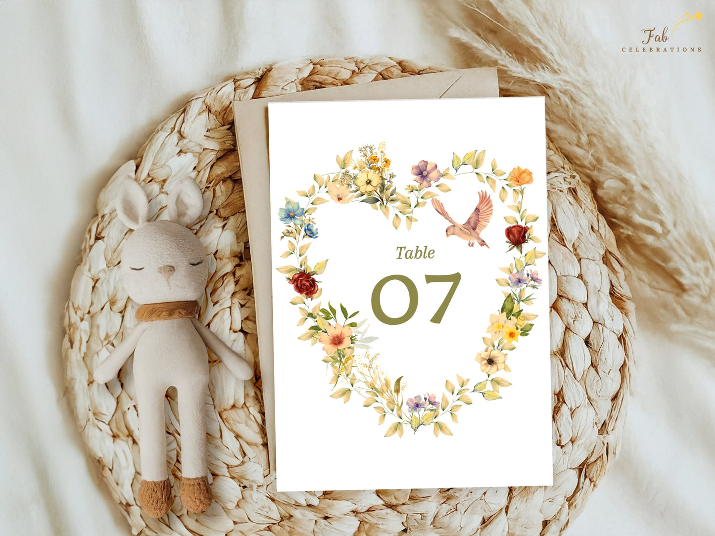 Romantic Wedding Table Number featuring a watercolor-inspired floral heart wreath, graceful dove illustration, soft beige background and editable Canva design for elegant wedding receptions.