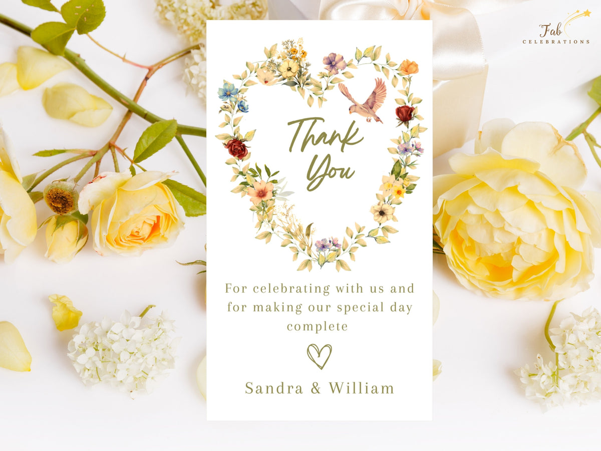 Romantic Wedding Thank You Card featuring a watercolor-inspired floral heart with delicate garden blossoms, two graceful doves, a heartfelt gratitude message, and personalized couple names.