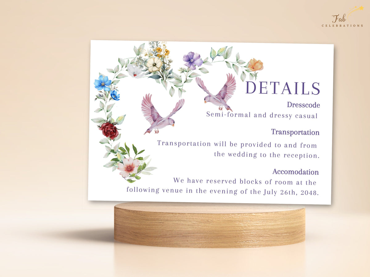 Wedding details card featuring romantic watercolor-inspired flowers, delicate greenery and two graceful doves with elegant guest information for dress code, transportation and accommodations.