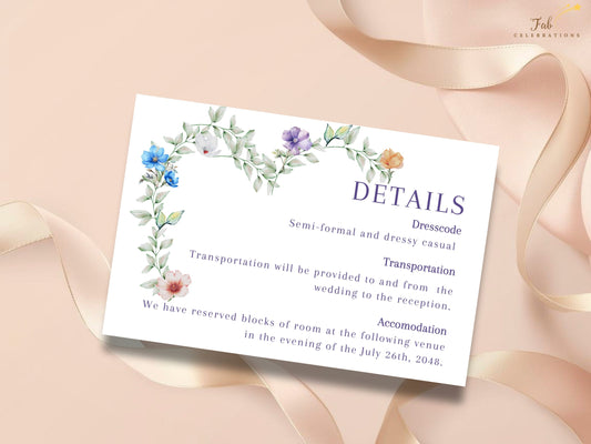 Soft Floral Wedding Details Card featuring elegant purple typography framed by watercolor-inspired greenery and delicate blue, purple, white, peach and pink flowers, with editable sections for dress code, transportation and accommodation.