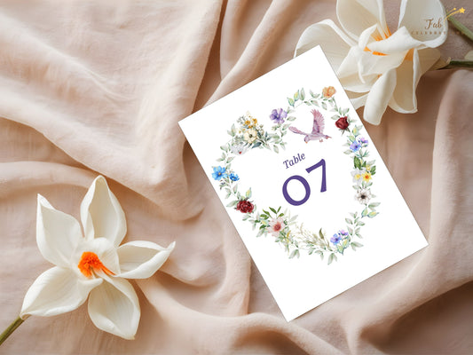 Watercolor dove wedding template table number card featuring floral heart design, rustic greenery and dove motif symbolizing unity, editable in Canva for boho chic receptions.