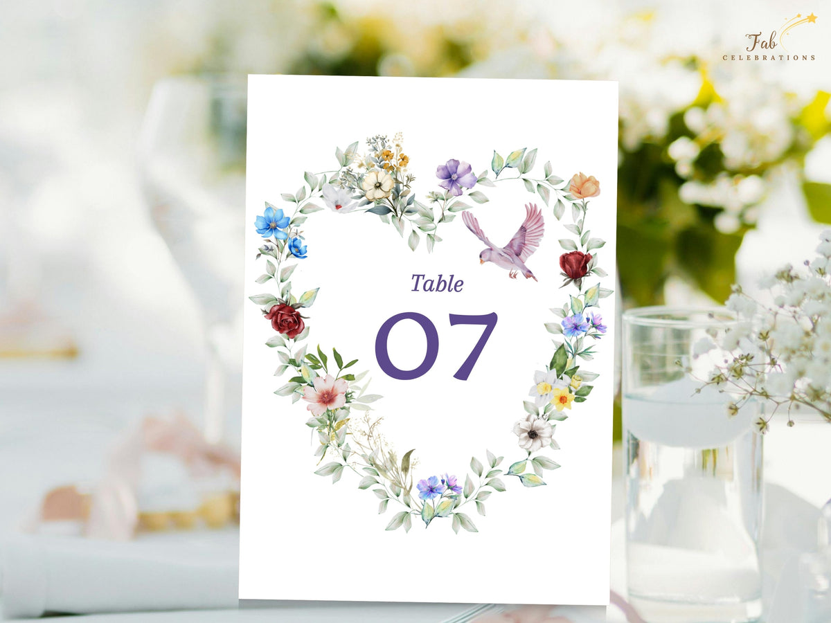 Watercolor Dove Wedding Template floral table number card featuring a romantic watercolor-inspired heart of colorful garden blossoms, leafy greenery and a graceful dove around number 07.