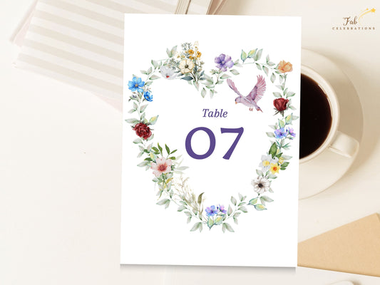 Watercolor Dove Wedding Template table number card featuring a watercolor-inspired floral heart with colorful blossoms, soft greenery and a graceful dove framing the elegant number 07.