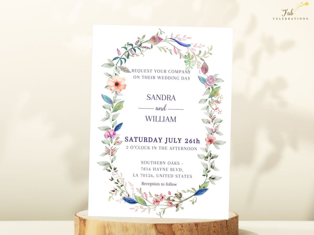 Romantic floral wedding invitation framed with delicate watercolor flowers, colorful botanical foliage and elegant typography for a graceful and coordinated wedding design.