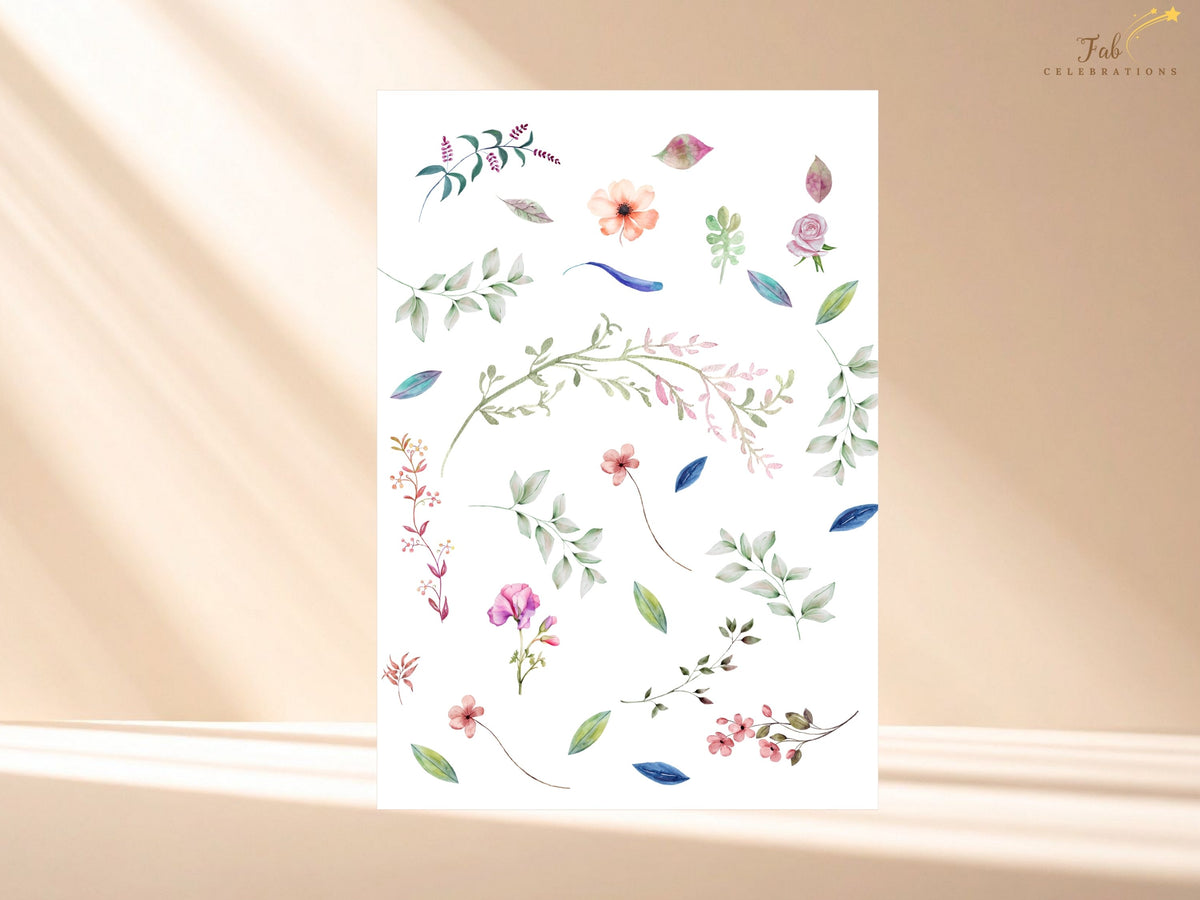 Watercolor floral design elements used throughout the wedding stationery collection, featuring delicate pink, peach and blue flowers with green leaves and graceful botanical accents.
