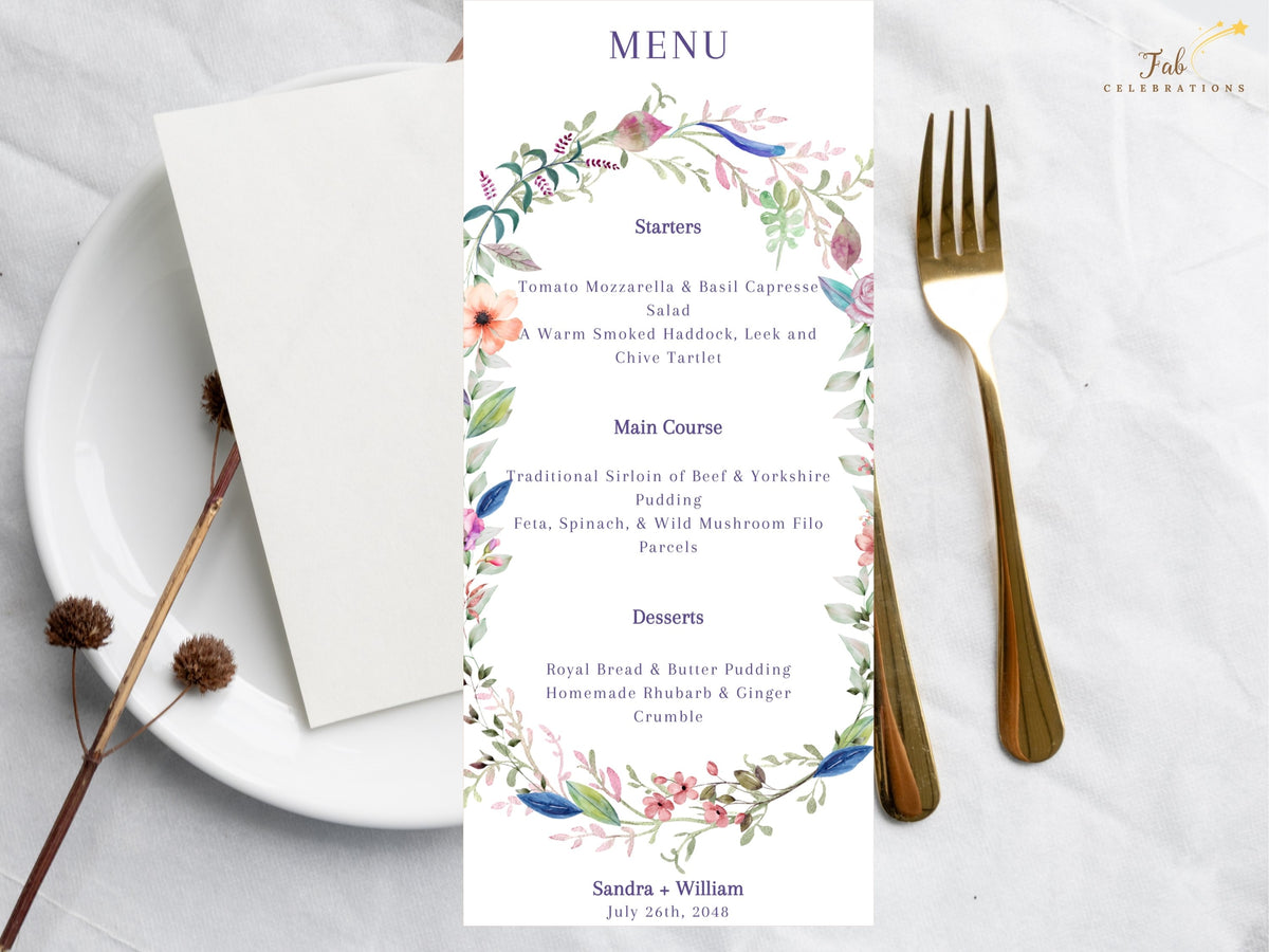Watercolor wedding menu card featuring a delicate floral composition with pink, peach and blue blossoms, graceful green foliage and an elegant reception menu layout.