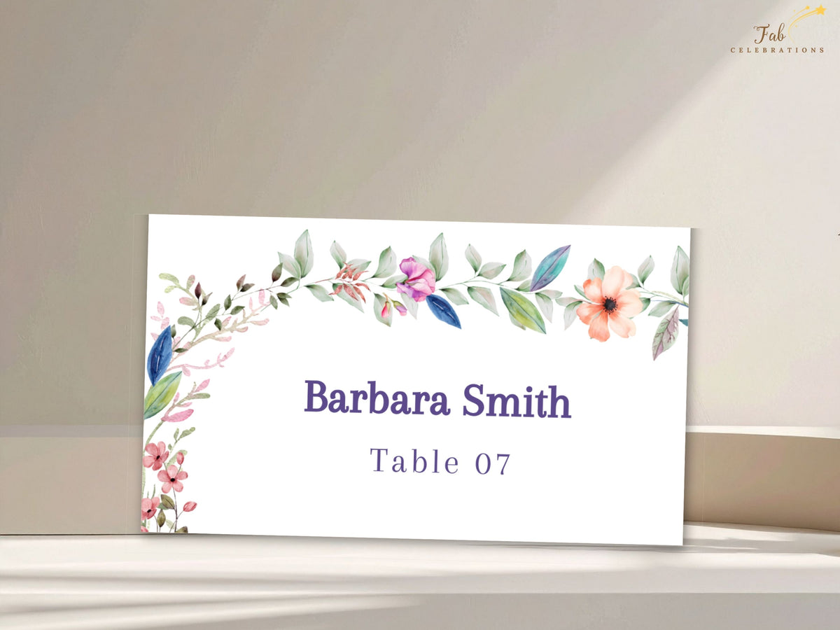 Editable Canva wedding place card featuring delicate watercolor-inspired botanical accents with customizable guest name and table number text.