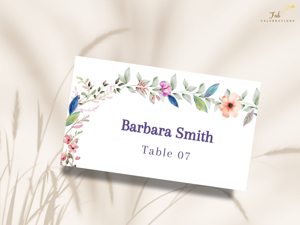Editable reception place card with delicate watercolor-inspired flowers and greenery, personalized guest name, and customizable table number.