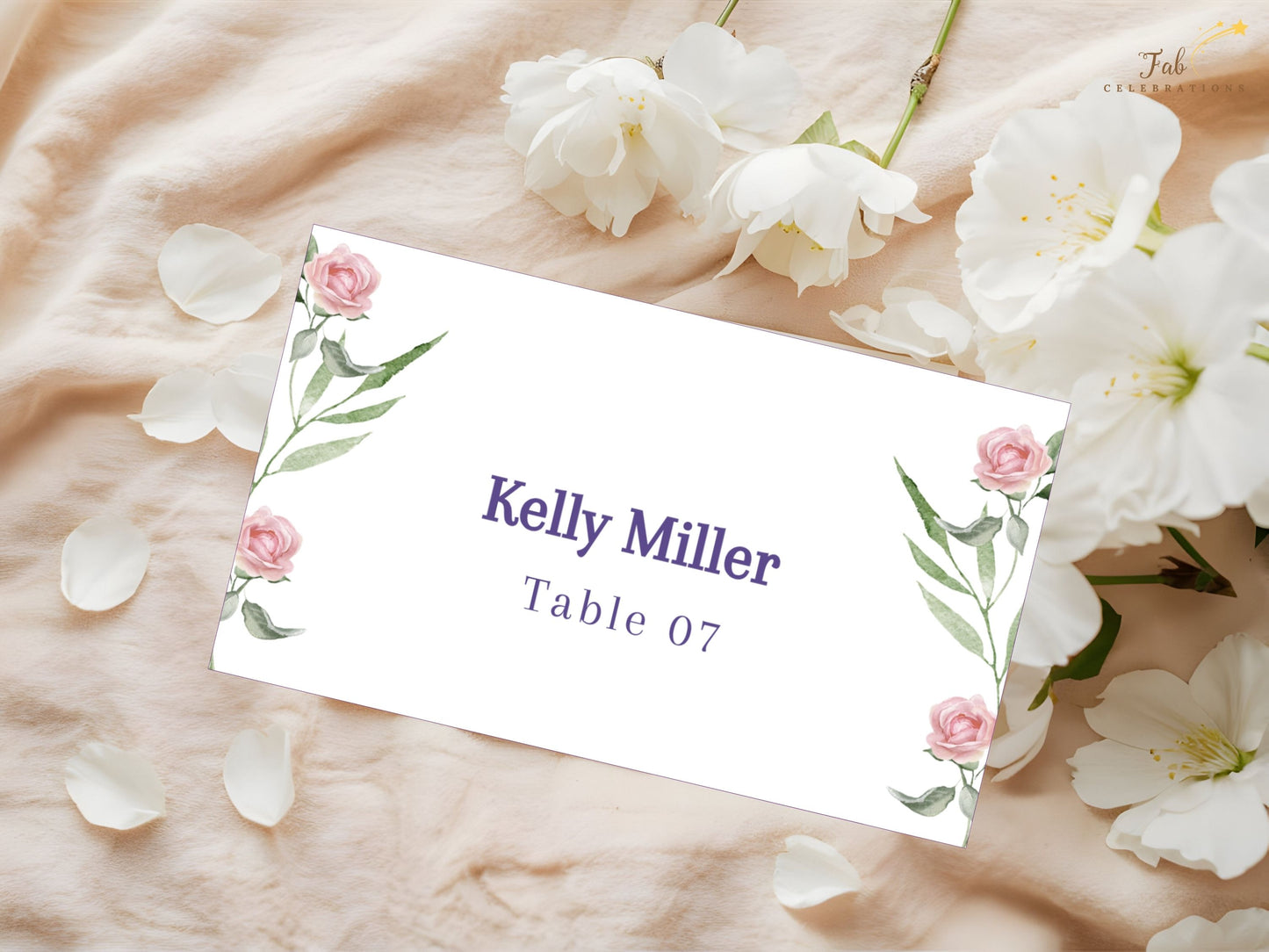 Wedding place card template with watercolor pink roses and greenery — editable Canva design for personalized reception seating with elegant floral charm.