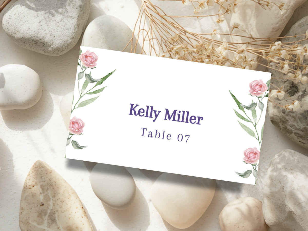 Wedding Place Card Template with delicate pink rose accents, elongated green foliage and elegant typography, designed to coordinate with matching floral wedding stationery.