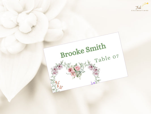 Boho wedding place cards with pink and green watercolor florals, customizable in Canva, perfect for organizing guest seating with charm and softness.