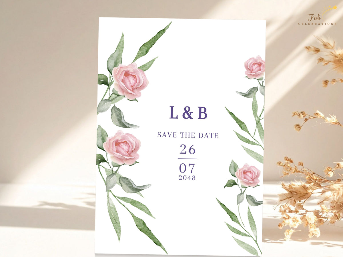 Elegant floral save the date announcement featuring watercolor-inspired blush roses and leafy green accents around a clean central arrangement of initials and wedding date.