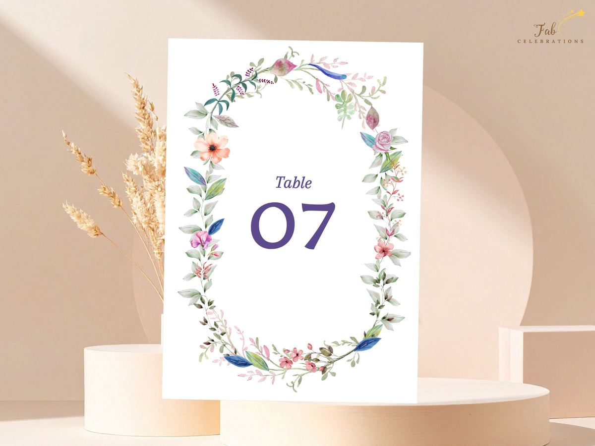 Wedding Table Number designed as an editable Canva reception sign with a watercolor-inspired floral wreath, delicate greenery, blossoms, and customizable numbering.