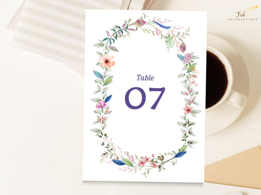 Wedding Table Number featuring a delicate watercolor-inspired floral wreath with soft blossoms, greenery, and elegant numbering for coordinated reception table styling.