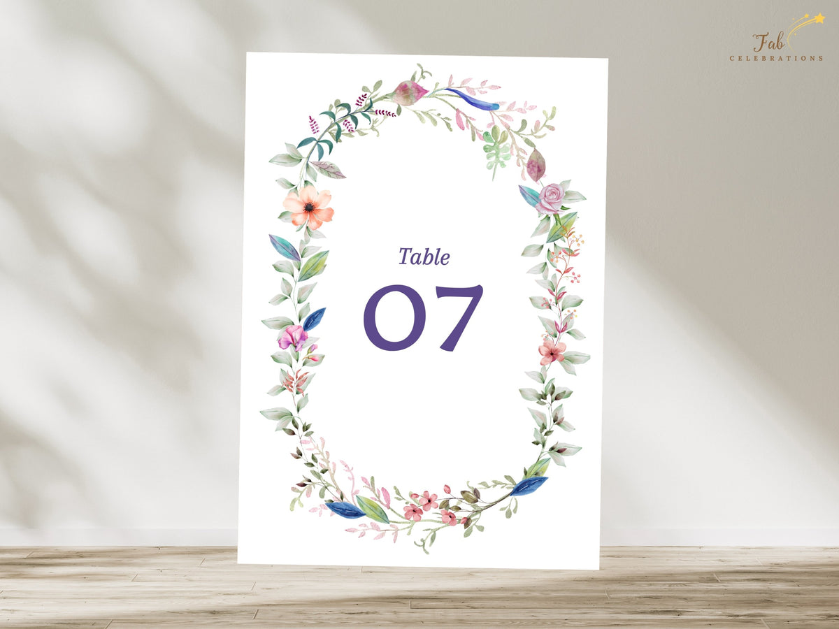 Floral wedding reception number card featuring watercolor-inspired botanical details, elegant typography, and customizable numbering for coordinated table displays.