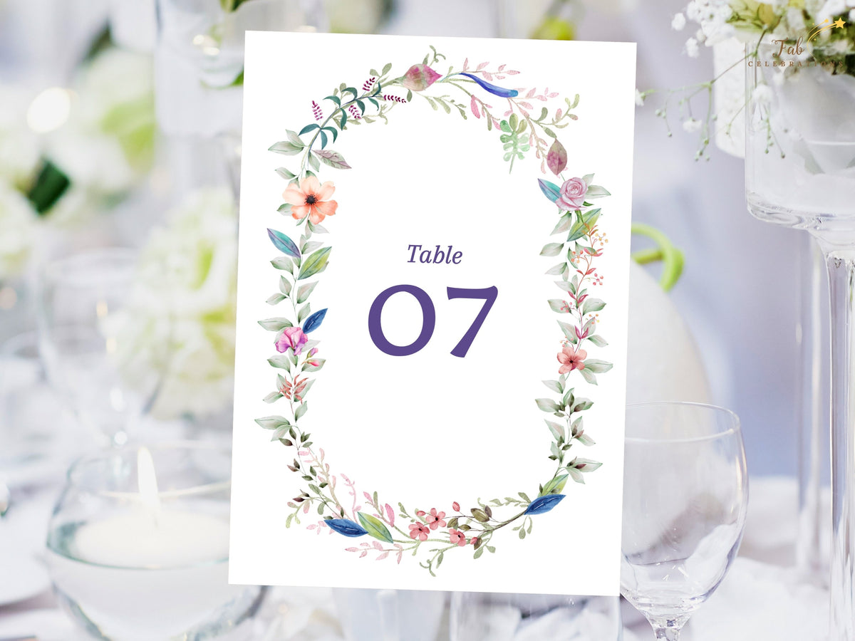 Printable floral wedding table number featuring a watercolor-inspired botanical wreath with elegant numbering for coordinated reception table decor.