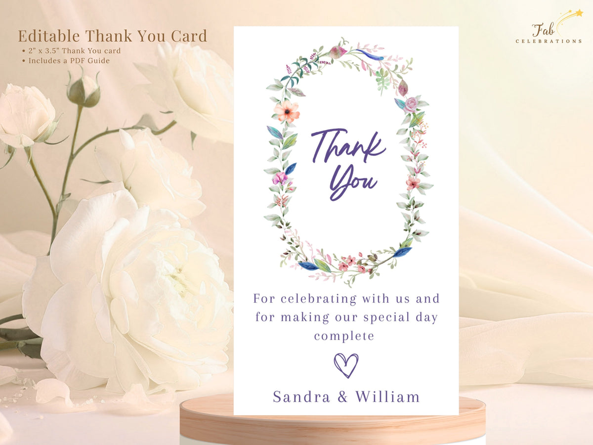 Editable wedding thank you card shown with descriptive text, featuring a watercolor-inspired floral wreath, elegant thank you lettering, personalized message, and couple names.