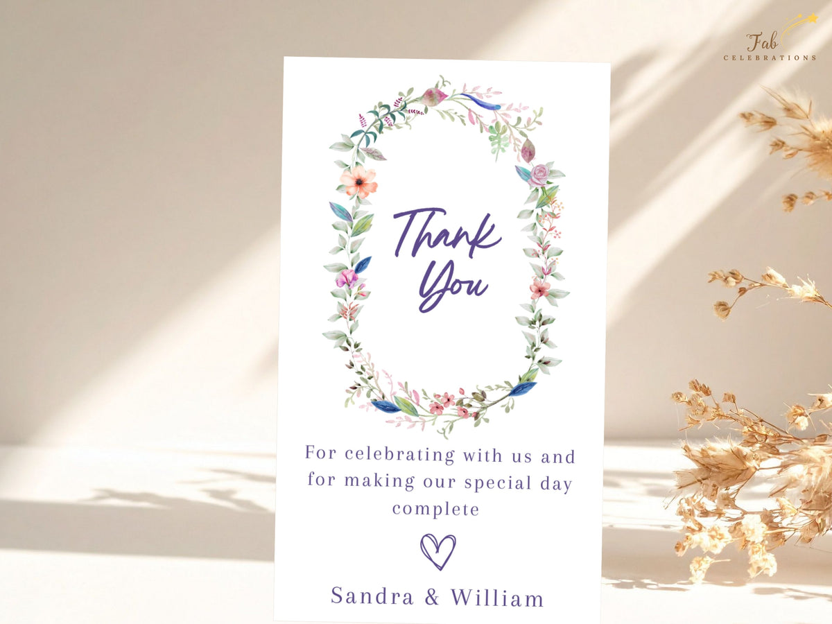 Editable wedding thank you note decorated with a watercolor-inspired floral wreath, elegant thank you lettering, customizable appreciation wording, and personalized couple names.