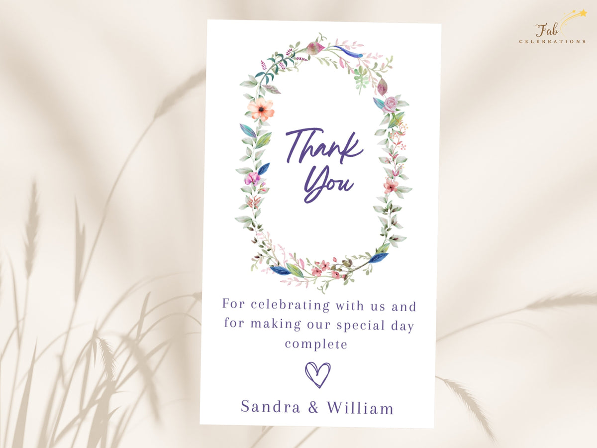 Floral wedding appreciation note featuring a delicate watercolor-inspired botanical wreath, elegant thank you wording, personalized message, and couple names.