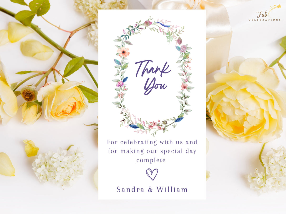 Wedding Thank You Card featuring a delicate watercolor-inspired floral wreath around elegant thank you lettering, with customizable appreciation wording and couple names.