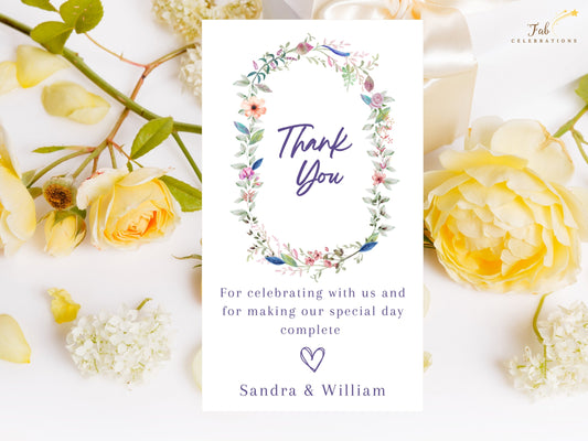 Wedding Thank You Card featuring a delicate watercolor-inspired floral wreath around elegant thank you lettering, with customizable appreciation wording and couple names.