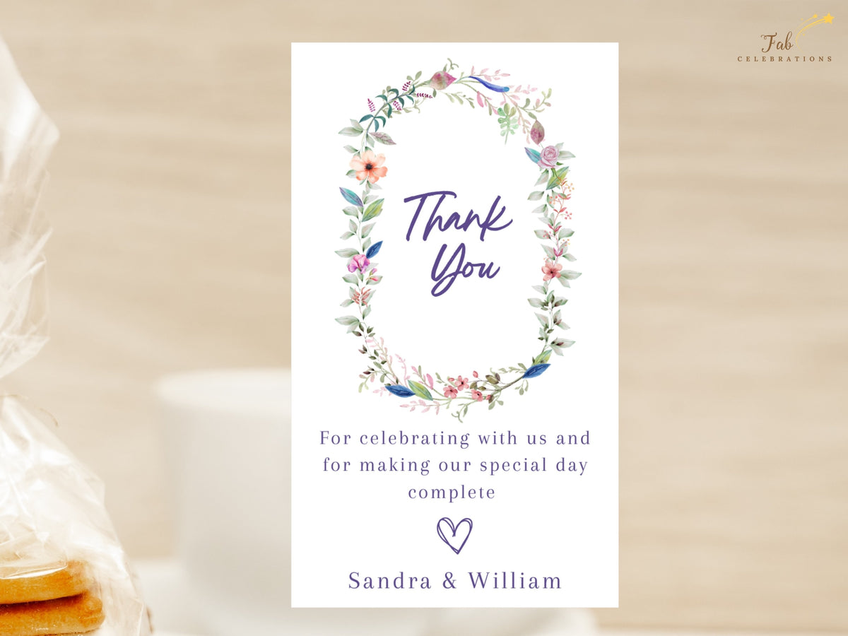 Printable floral wedding thank you note with a watercolor-inspired botanical wreath, customizable thank you message, elegant lettering, and personalized couple names.
