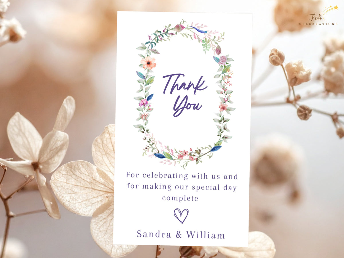 Floral wedding thank you card with a romantic watercolor-inspired wreath, elegant thank you lettering, personalized appreciation message, and couple names.